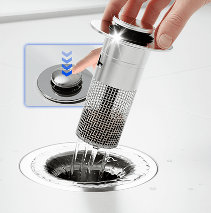 Pop-up sink stopper with a removable mesh basket above a bathroom sink drain