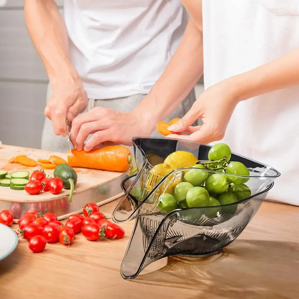 FreshBox expandable colander resting across a kitchen sink