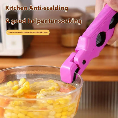 Silicone clip gripping a hot bowl