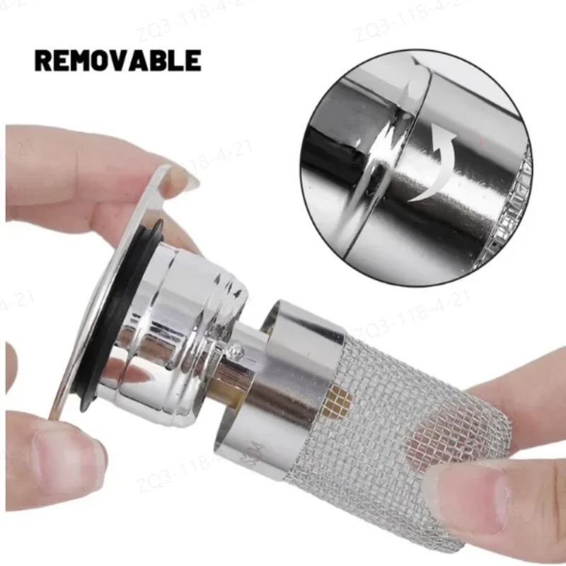 Hands removing the strainer basket from the pop-up sink stopper